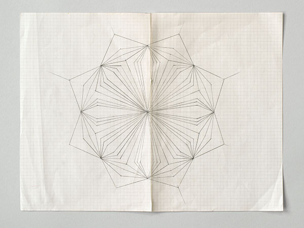 Photograph of a geometric pencil drawing by Helen Murray on graph paper on a grey background