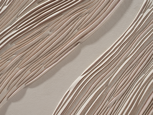 Detail of hand-sculpted artwork by Helen Amy Murray of a sand dune in cream faux suede